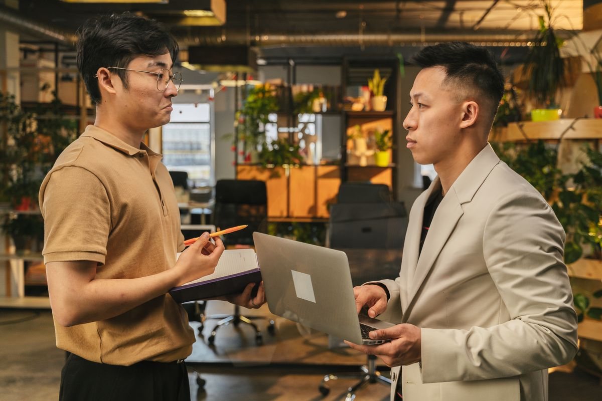 Two people working together on a device