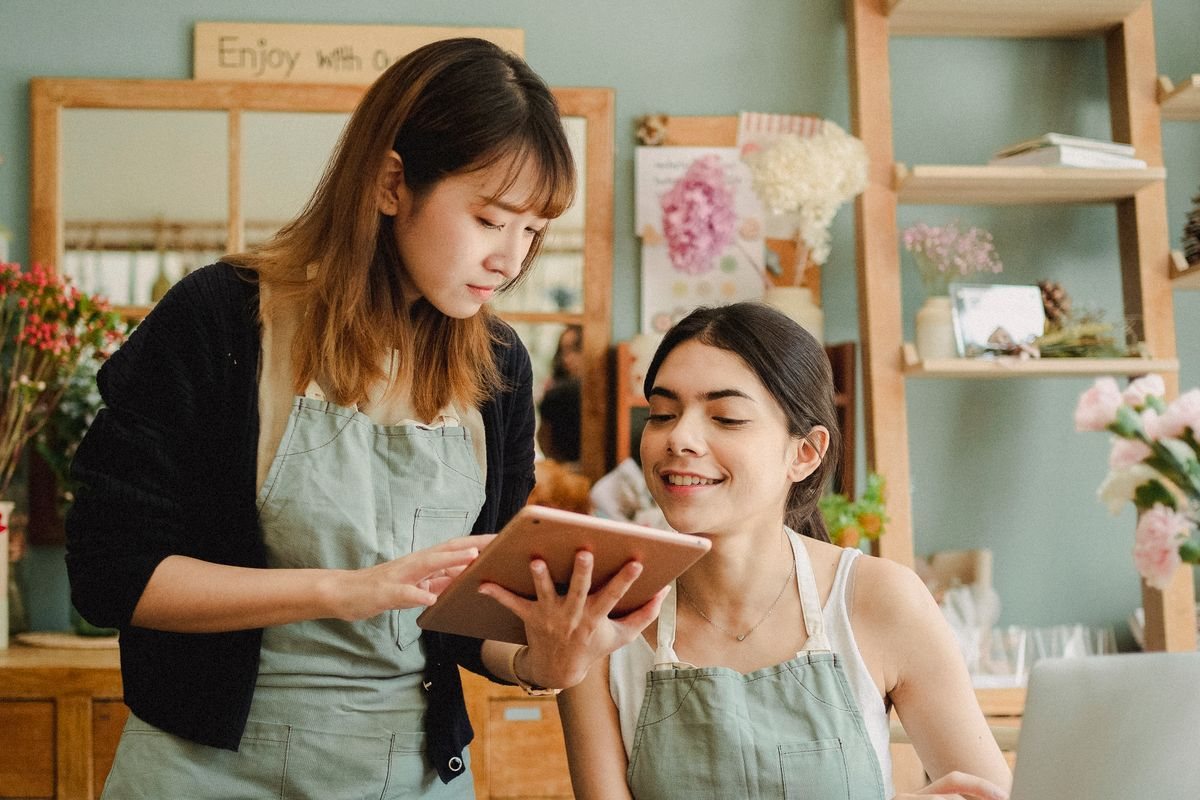 Two people working together on a device